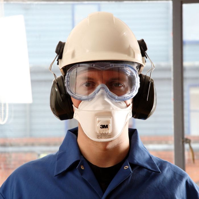 Man wearing a 3M 9322A+ Disposable Respirator with hard hat goggles and ear muffs