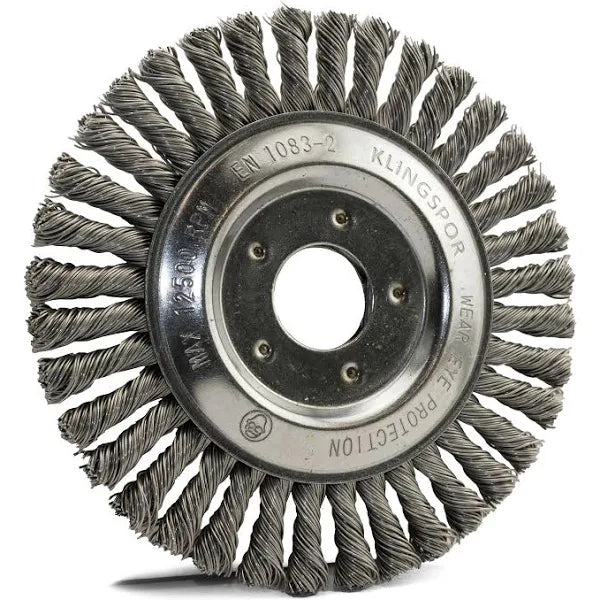 Mild-steel pipeline wheel brush with a circular central hub connected to steel wires that form a dense mesh,for angle grinders.