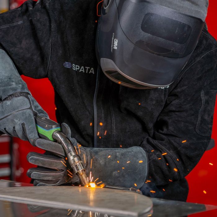 Man welding wearing protective gear including a Spata Leather welding Jacket