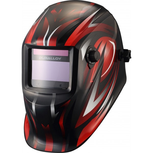 A red welding helmet with a geometric pattern design, featuring a large auto-darkening welding lens.