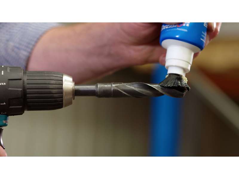 Applying the XDP905 Paste Tube with Brush to a drill bit