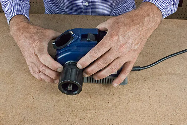Drill Doctor DDXP Drill Bit Sharpener – Held by User at Workshop Bench