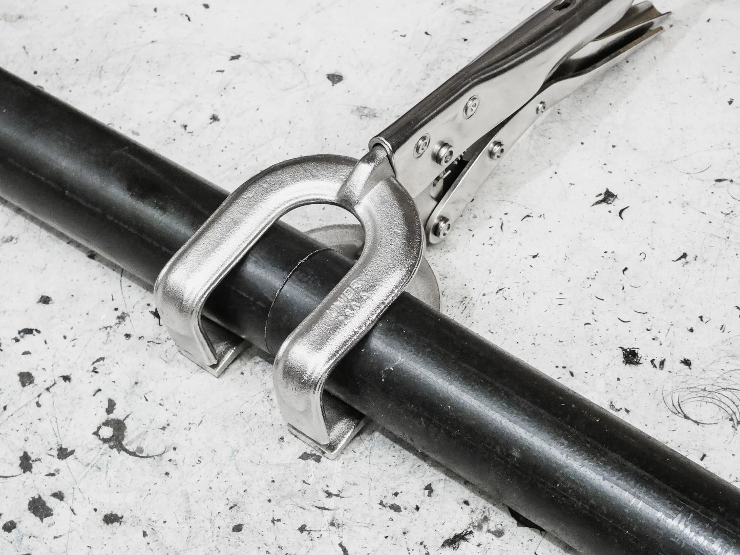 welding pliers griplox excision fitted around pipe 