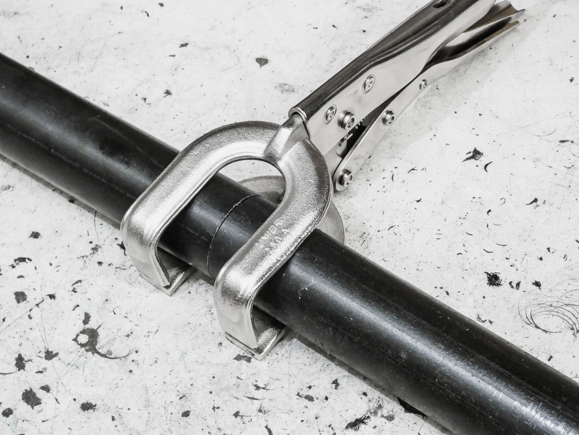 welding pliers griplox excision fitted around pipe 